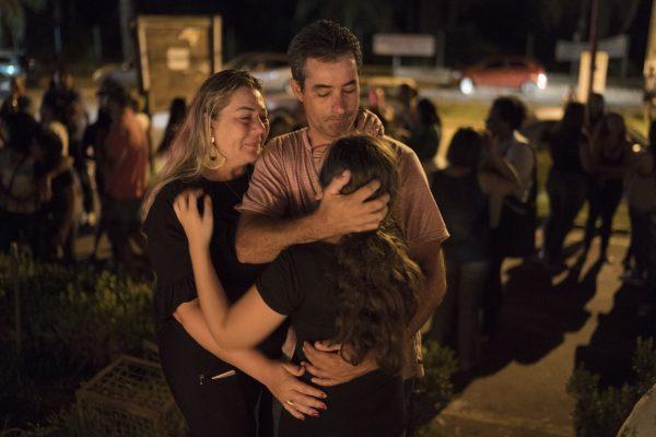 A family embraces during a vigil for the victims of the collapsed mining company dam in Brumadinho, Brazil, on Jan. 29, 2019. (Leo Correa/AP Photo)