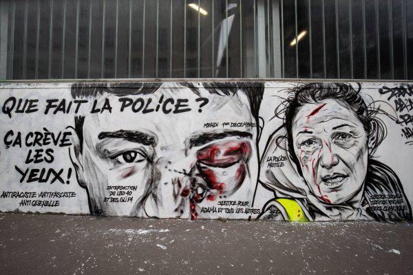 A mural by French artist collective Black Lines depicts a man wounded in the eye and reads "What does the police? It's so obvious," in Paris on Jan. 29, 2019. (Thomas Samson/AFP/Getty Images)