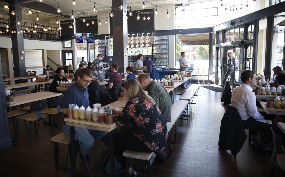 FILE—ustomers dine at the Wursthall Restaurant & Bierhaus in San Mateo, Calif., on May 9, 2018. (Michael Mayor/San Francisco Chronicle via AP, File)