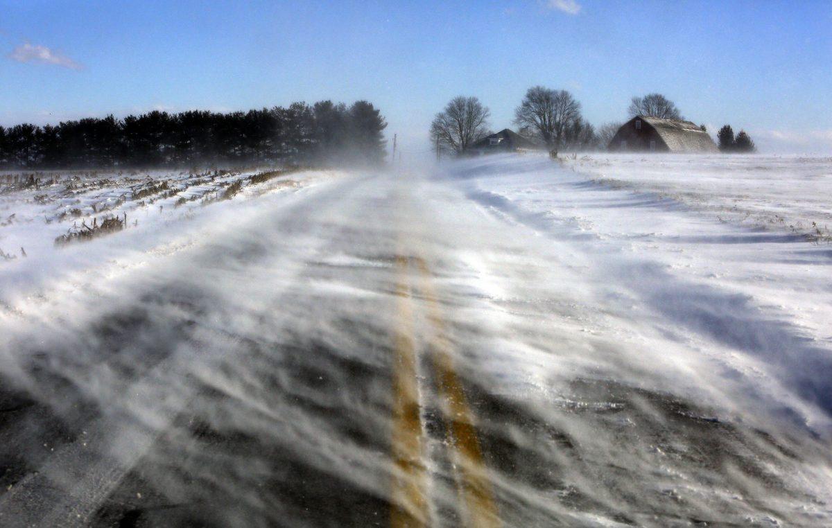 Drifting snow obscures a road near Mount Joy in Lancaster County, Pa., on Jan. 30, 2019. A bitter deep freeze is moving into the Northeast from the Midwest, sending temperatures plummeting and making road conditions dangerous. (Jacqueline Larma/AP Photo)
