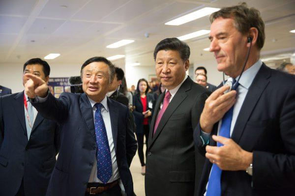Chinese leader Xi Jinping (C) is shown around the offices of Huawei by its President Ren Zhengfei (2nd L) in London during Xi's state visit on Oct. 21, 2015. (Matthew Lloyd/AFP/Getty Images)