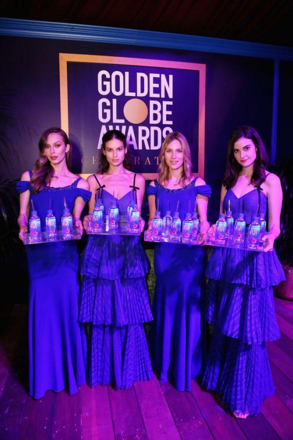 Kelleth Cuthbert (far right), whose real name is Kelly Steinbach, has sued Fiji water, alleging the company used her likeness without permission. In this image models pose at the 76th Annual Golden Globe Awards Celebration in Los Angeles, Cali., on Jan. 6, 2019. Gabriel Olsen/Getty Images for FIJI Water)