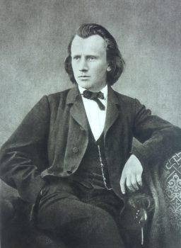 A photograph of Johannes Brahms in 1866, by Lucien Mazenod. (Public Domain)