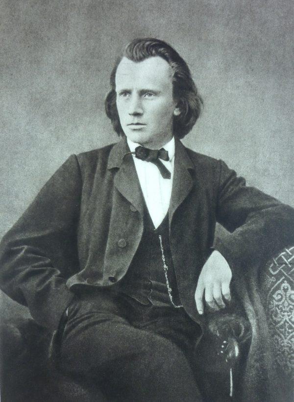 A photograph of Johannes Brahms in 1866 by Lucien Mazenod. (Public Domain)