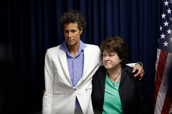 Bill Cosby accuser Andrea Constand, left, and her attorney Dolores Troiani listen during a news conference after Cosby was found guilty in his sexual assault trial, in Norristown, Pa. Constand’s defamation lawsuit against former prosecutor Bruce Castor has been settled, on April 26, 2018. (Matt Slocum/AP File Photo)