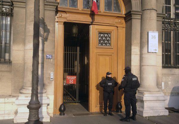 Police officers stand guard in front of the 36 Quai des Orfevres police headquarters in Paris in a file photo. (Francois Mori/AP Photo, File)