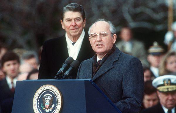 US President Ronald Reagan (L) with Soviet leader Mikhail Gorbachev during welcoming ceremonies at the White House on the first day of their disarmament summit, on Dec. 8, 1987. (Jerome Delay/AFP/Getty Images)