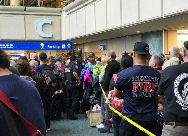 Passengers stranded at Orlando International Airport on Feb. 2, 2019. (Jonathan Hayward/The Canadian Press via AP)