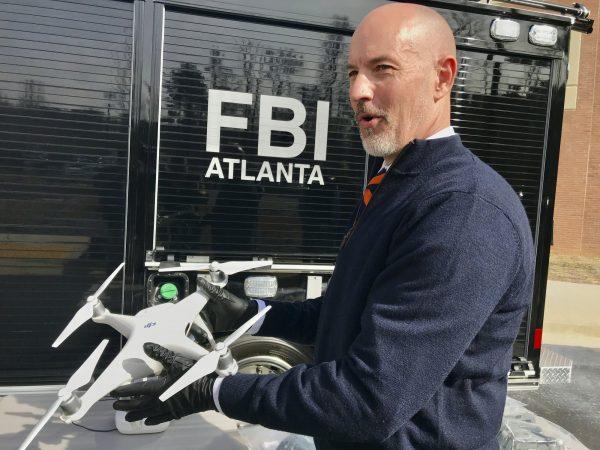 FBI Special Agent John Cronier holds one of a half-dozen drones which have been confiscated for being flown in the no-fly zone over Mercedes-Benz Stadium ,in Atlanta, just days before Super Bowl 53,on Feb. 1, 2019.(AP Photo/Jeff Martin)