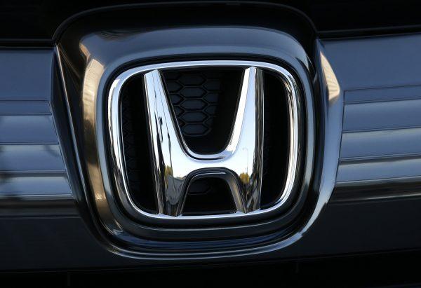  In this Jan. 11, 2016, file photo, the logo of Honda Motor Co. is seen on a Honda vehicle at the Japanese automaker's headquarters in Tokyo. (Shuji Kajiyama/AP)