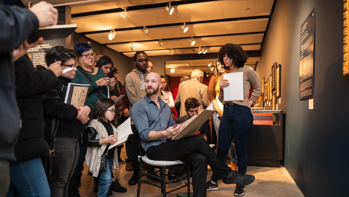 Joshua Henderson teaches people how to draw at the Old Master Drawings sale at Sotheby's, in New York on Jan. 27, 2019. (Julian Cassady)