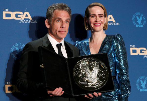Ben Stiller, director of "Escape at Dannemora" holds his medallion as he poses with Sarah Paulson after winning the Movies for Television and Limited Series category at the Directors Guild Awards in Los Angeles, Calif., on Feb. 2, 2019. (Reuters/Mario Anzuoni)
