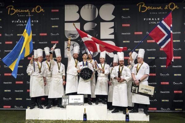 Kenneth Toft-Hansen of Denmark (C), celebrates with his teammates on the podium after winning the final of the "Bocuse d'Or" (Golden Bocuse) trophy, in Lyon, central France, on Jan. 30, 2019. (AP Photo/Laurent Cipriani)