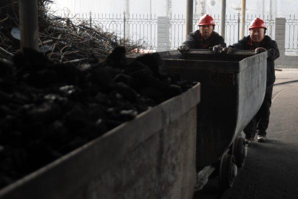  Laborers work at a coal mining facility in Huaibei, eatern China’s Anhui Province on March 4, 2014. (STR/AFP/Getty Images)