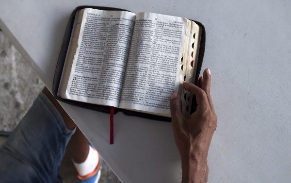 A Panamanian evangelical pastor reads the Bible in the El Chorrillo neighborhood in Panama City on Jan. 21, 2019. (Raul Arboleda/AFP/Getty Images)