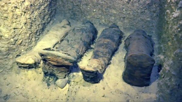 Wrapped mummies inside burial site in Tuna El-Gebel Region, Minya, Egypt, on Feb. 2, 2019. (Screenshot/Reuters)