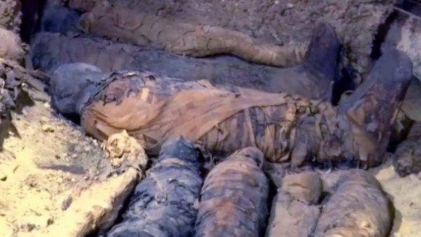 Wrapped mummies inside burial site in Tuna El-gebel Region, Minya, Egypt, on Feb. 2, 2019. (Screenshot/Reuters)