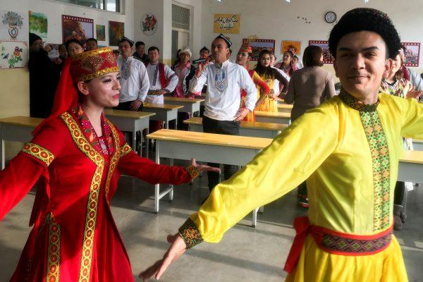 Residents at the Kashgar City vocational educational training center dance for visiting reporters and officials in a classroom during a government organized visit in Kashgar, Xinjiang Uyghur Autonomous Region, China on Jan. 4, 2019. (Ben Blanchard/Reuters)