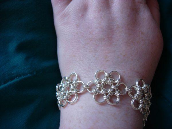 Person wearing a metal bracelet. (Lisa Paul/Flickr/CC BY 2.0)