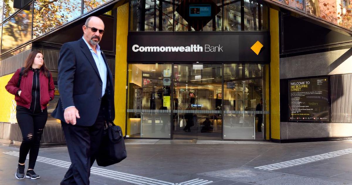 People walk past a branch of Australia's Commonwealth Bank in Melbourne on June 4, 2018. (William West/AFP/Getty Images)