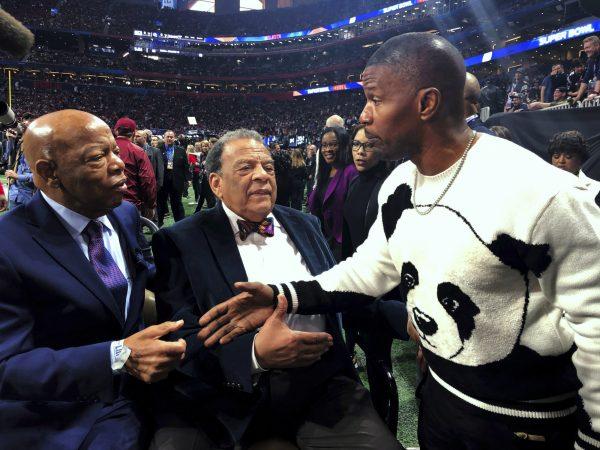 U.S. Rep. John Lewis, D-Ga., left, former U.N. Ambassador Andrew Young and entertainer Jamie Foxx, right, speak on the sidelines before the NFL Super Bowl 53 football game between the Los Angeles Rams and the New England Patriots in Atlanta, on Feb. 3, 2019. (Jonathan Landrum Jr/AP)