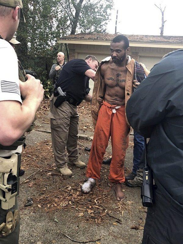 Cedric Marks being captured after a nine-hour manhunt that began when he escaped from a prisoner transport van in Conroe, Texas, on Feb. 3, 2019. (Conroe Police Department via AP)