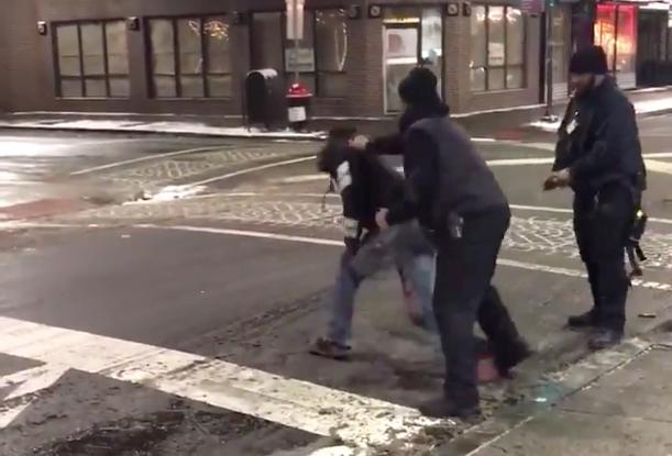Security grapple with the man on Feb.1 outside the Philadelphia steak house. (Storyful/Pat Tackney)