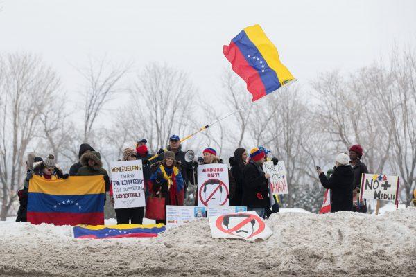 Protestors against the regime of Nicolas Maduro in Venezuela show their support for Juan Guaido outside the 10th Lima Group in Ottawa on Feb. 24, 2019. (Lars Hagberg/AFP/Getty Images)