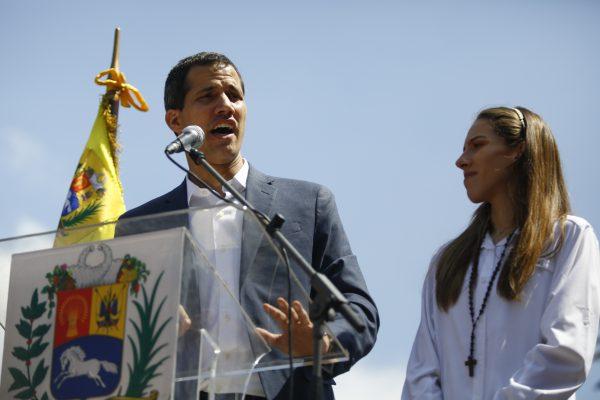 Opposition leader and self-proclaimed interim president of Venezuela Juan Guaidó and his wife Fabiana Rosales take part in a rally against the government of Nicolás Maduro in the streets of Caracas, Venezuela, on Feb. 2, 2019 . (Marco Bello/Getty Images)