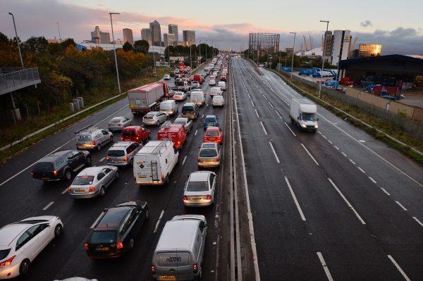 Traffic on a main route into London by the towers of the financial district Canary Wharf on Oct. 28, 2013. (Ben Stansall/AFP/Getty Images)