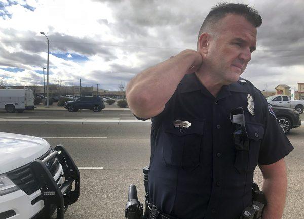 Officer Simon Drobik answers questions about an explosion that he says killed one person in Albuquerque, N.M., on Feb. 4, 2019. (Mary Hudetz/AP)