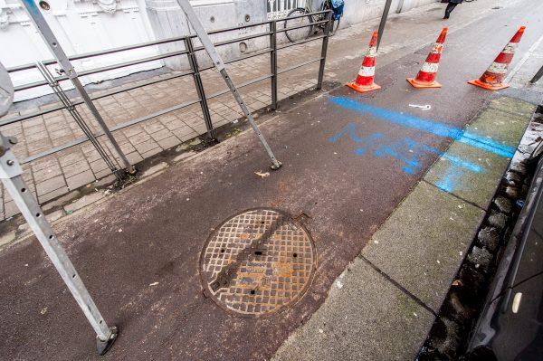The blue lines on the ground indicate where the tunnels are located, at a BNP Paribas Fortis bank branch, in Antwerp, Belgium, on Feb. 4, 2019. (Jonas Roosens/AFP/Getty Images)