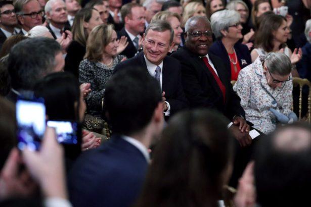 L-R) Supreme Court Chief Justice John Roberts, Associate Justices Clarence Thomas, and Ruth Bader Ginsburg attend the ceremonial swearing-in of Associate Justice Brett Kavanaugh in the East Room of the White House in Washington on Oct. 8, 2018. (Photo by Chip Somodevilla/Getty Images)