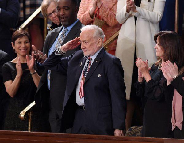 Former NASA astronaut Buzz Aldrin salutes as he is recognized by US President Donald Trump during the State of the Union address at the US Capitol on Feb. 5, 2019. (SAUL LOEB/AFP/Getty Images)