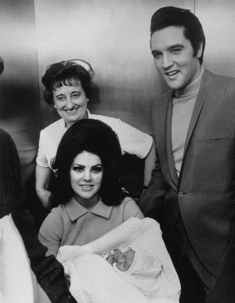 Rock 'n' roll superstar Elvis Presley (1935 - 1977), with his wife Priscilla and their new-born baby Lisa Marie, at the Baptist Hospital at Memphis, Tennessee. (Keystone/Getty Images)
