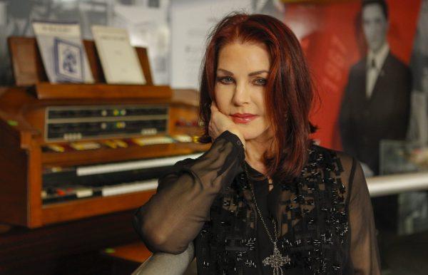 Priscilla Presley stands in the "60 years of Elvis" exhibit inside an annex at Graceland in Memphis, Tenn., on Feb. 21, 2014. (Lance Murphey/AP Photo)
