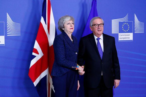 European Commission President Jean-Claude Juncker shakes hands with British Prime Minister Theresa May in Brussels on Feb. 7, 2019. (Francois Lenoir/Reuters)