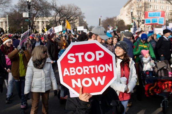 Anti-abortion activists participate in the "March for Life," an annual event to mark the anniversary of the 1973 Supreme Court case Roe v. Wade, which legalized abortion in the US, outside the US Supreme Court in Washington, on Jan. 18, 2019. (Saul Loeb/AFP/Getty Images)