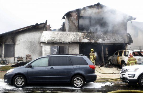 Firefighters work the scene of a deadly plane crash in the residential neighborhood of Yorba Linda, Calif., on Feb. 3, 2019. (Alex Gallardo/AP Photo)