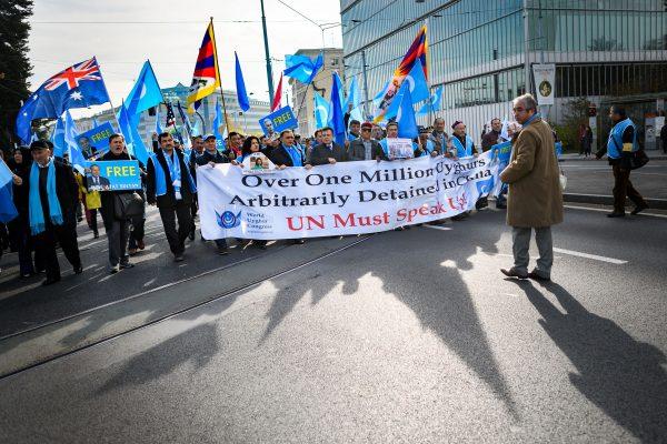 Uyghurs and Tibetan people demonstrate against China outside of the U.N. offices during the Universal Periodic Review of China by the UN Human Rights Council in Geneva, Switzerland, on Nov. 6, 2018. (Fabrice Coffrini/AFP/Getty Images)