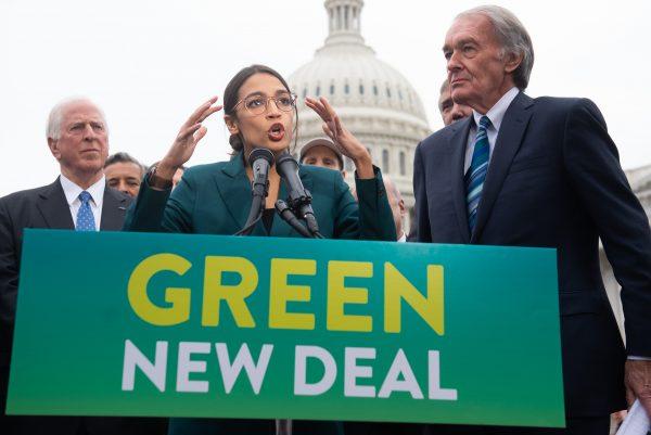 US Representative Alexandria Ocasio-Cortez, Democrat of New York, and US Senator Ed Markey (R), Democrat of Massachusetts, speak during a press conference to announce Green New Deal legislation to promote clean energy programs outside the US Capitol in Washington on Feb. 7, 2019. (Saul Loeb/AFP/Getty Images)