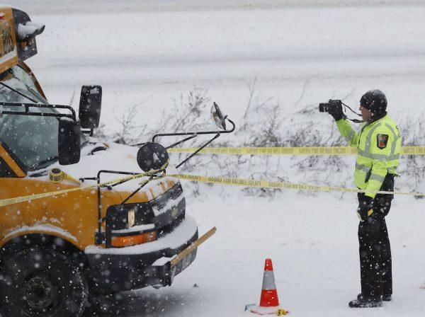 The driver of a school bus was taken to the hospital in a shooting on HWY 35 near downtown Minneapolis, on Feb. 5, 2019. (Richard Tsong-Taatarii/Star Tribune via AP)