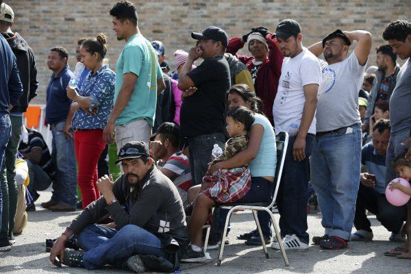 Central American immigrants line up to register with Mexican Immigration officials at a shelter in Piedras Negras, Mexico, on Feb. 5, 2019. (Jerry Lara/The San Antonio Express-News via AP)