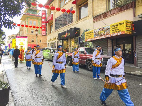 Dan Ngo leads his team of archers through San Francisco Chinatown on February 9, 2019. (Joel Ng)