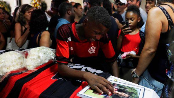 A friend reacts as he attends the funeral service for soccer player Vinicius de Barros Silva Freitas after a deadly fire at Flamengo soccer club's training center, in Volta Redonda, Brazil, on Feb. 9, 2019. (Ricardo Moraes/Reuters)