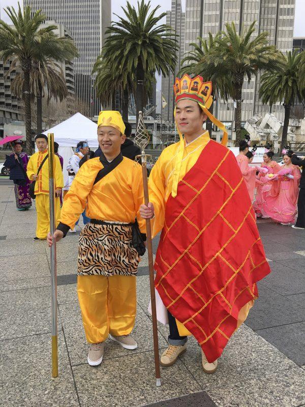 David Huang (L) dressed as the Monkey King next to monk Tang on February 9, 2019. (Ilene Eng/The Epoch Times)