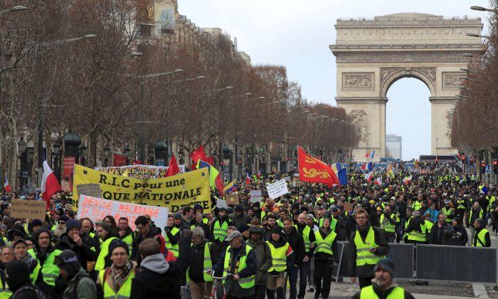 France’s ‘yellow vests’ march largely without violence as tensions ease