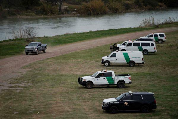 U.S. border patrol vehicles are stationed near the banks of Rio Grande as seen from Piedras Negras, Feb. 8, 2019. (Alexandre Meneghini/Reuters)
