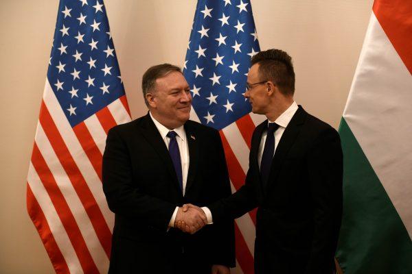 U.S. Secretary of State Mike Pompeo shakes hands with Hungarian Foreign Minister Peter Szijjarto before a plenary session in Budapest, Hungary, February 11, 2019. (Reuters/Tamas Kaszas)