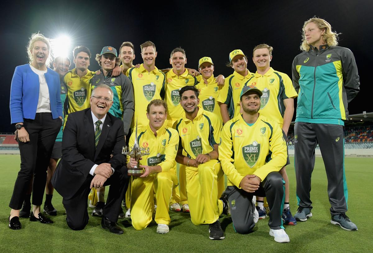 Prime Minister Scott Morrison and Deputy Nationals leader Bridget McKenzie (L) with the Australian team after they won the One Day International warm up match between the PM's XI and South Africa at Manuka Oval on Oct. 31, 2018 in Canberra, Australia. (Tracey Nearmy/Getty Images)